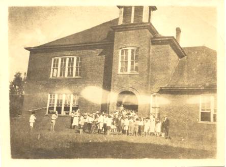 Students outside the newly acquired Madison High School 1908 or 1910